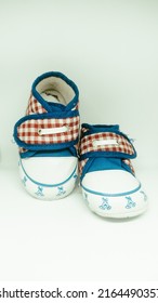 Cute Baby Shoes Close Up On Gray Background