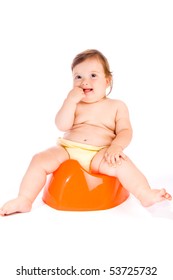 Cute Baby Sitting On The Orange Potty