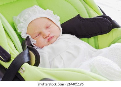 Cute Baby Sleeping In A Car Seat.