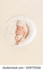 Cute Baby Sleeping On A Moon Shaped Pillow