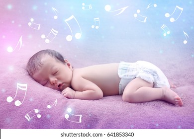 Cute baby sleeping on plaid. Lullaby songs and music concept
