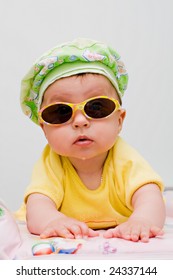 Cute Baby In Sunhat And Sunglasses