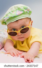 Cute Baby In Sunhat And Sunglasses