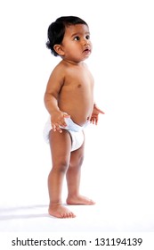 Cute Baby Toddler Standing And Looking Amazed Surprised Up Wearing Diaper, Childhood Concept.