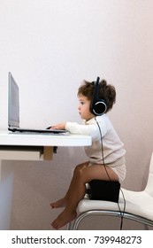 Cute Baby-operator With Laptop. Interview Questions Concept Online Skype