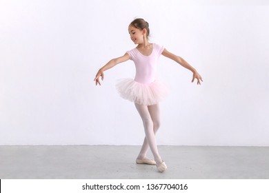 Cute Ballerina Little Girl In Pink Tutu Dance Practice In The Room, Kid Ballet Concept.