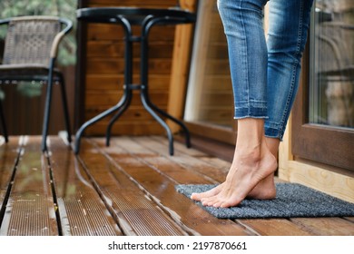 Cute Barefoot Female Legs In Jeans On Terrace