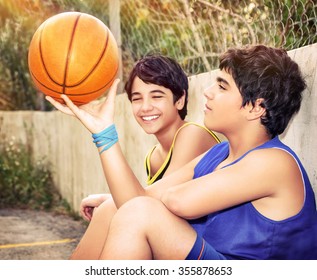 Cute Basketball Players Sitting And Resting In Timeout, Two Active Teen Boys Enjoying Outdoor Games, Happy Youth Lifestyle