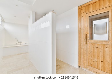 Cute Bathroom In A Snow-white Tone With A Light Tiled Floor