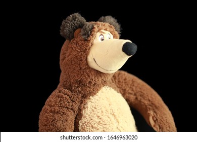 Cute bear from Masha and the Bear isolated in black background