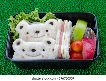 Cute Bear Sandwich With Ham And Cheese In Bento Box. Along With Apples, Tomatoes, And Vegetable.