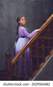 Cute Beautiful Caucasian Girl In A Pink Purple Dress Posing On Wooden Stairs Inside Old Chinese House