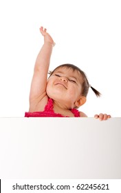 Cute Beautiful Happy Baby Infant Girl Holding White Board While Reaching Up In The Air With Pride, Isolated.