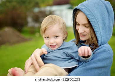 Cute Big Sister Cuddling With Her Toddler Brother. Adorable Teenage Girl Holding Baby Boy. Children With Large Age Gap. Big Age Difference Between Siblings. Big Family.