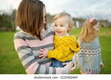 Cute Big Sister Cuddling With Her Toddler Brother. Adorable Teenage Girl Holding Baby Boy. Children With Large Age Gap. Big Age Difference Between Siblings. Big Family.