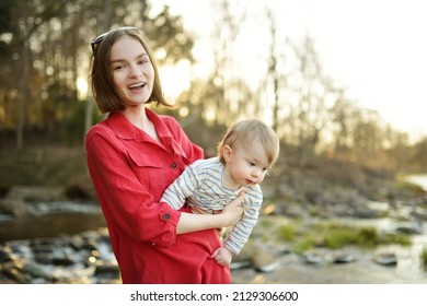 Cute Big Sister Cuddling With Her Toddler Brother. Adorable Teenage Girl Holding Baby Boy. Children With Large Age Gap. Big Age Difference Between Siblings. Big Family.