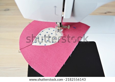 Cute bird zipper pouch working process: sewing machine, threads and applique pieces