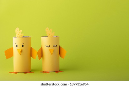 cute birds made of toilet paper on a green background. creative with animals for the holiday - Shutterstock ID 1899316954