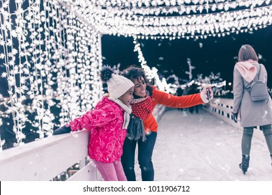 Cute Black Girl Taking Selfie Photo With Her Mother At Ice Skating.