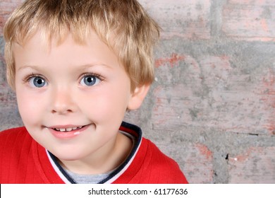 Cute Blond Boy With Big Blue Eyes