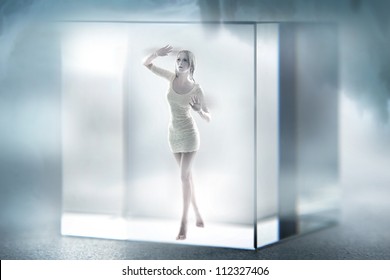 Cute Blond Lady Imprisoned In A Glass Cube