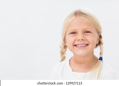 Cute Blonde Girl With Pigtails Smiling