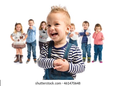 Cute Blonde Kid Running With Many People Behind