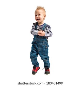 Cute Blonde Kid Running Over White Background.