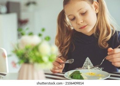 Cute Blonde Teen Girl Eating Eggs Benedict With Knife And Fork