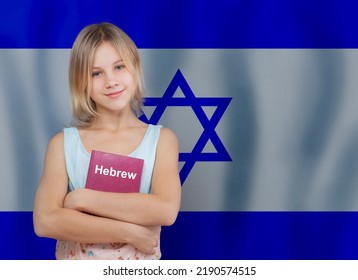 Cute Blonde Teen Girl Embracing Book With Inscription Hebrew In Hebrew Language On Flag Of Israel Background