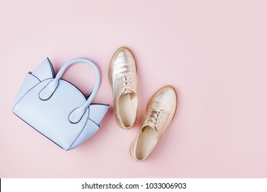 Cute blue ladies bag and stylish golden shoes. Flat lay, top view. Spring fashion concept in pastel colored - Shutterstock ID 1033006903