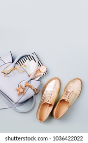 Cute blue ladies bag, stylish golden shoes and  feminine accessories . Flat lay, top view. Spring fashion concept in pastel colored  - Shutterstock ID 1036422022