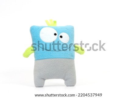A cute blue toy on a white background	
