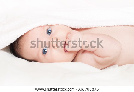 Cute blue-eyed newborn baby