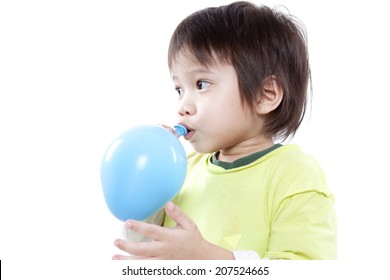 cute boy blowing up balloon isolated on white background