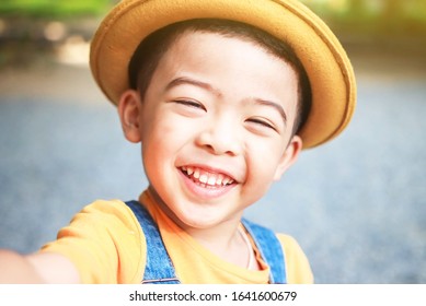 A cute boy came out to play in the garden. Portrait baby cute while looking at camera,  Happy and smiling  child.