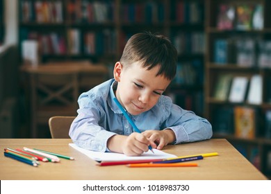 Cute  Boy Doing Homework,  Coloring Pages, Writing And Painting. Children Paint. Kids Draw. Preschooler With Books At Home. Preschoolers Learn To Write And Read. Creative Boy.