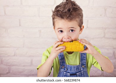 Cute Boy Eating Boiled Sweet Corn Stock Photo 568239874 | Shutterstock