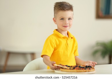 Cute Boy Eating Pizza At Home