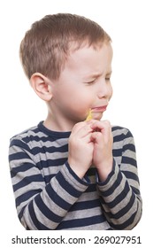 Cute Boy Eating Sour Candy On Isolated White