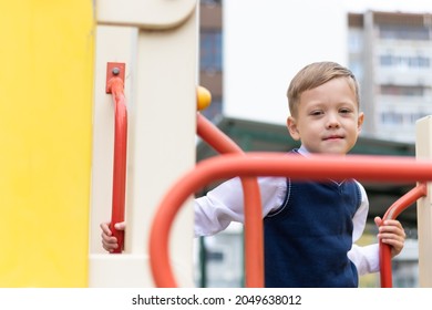 Cute Boy First Grader At School On The Playground On A Sunny Autumn Day. Celebration On September 1st. Knowledge Day. Selective Focus