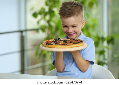 Cute Boy With Hot Pizza At Home