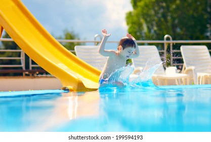 Cute Boy Kid Having Fun On Water Slide