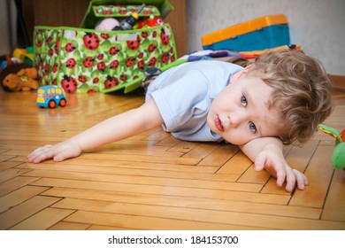 Cute Boy Playing In The Children Room