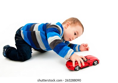 Cute Boy Playing With Toy Car