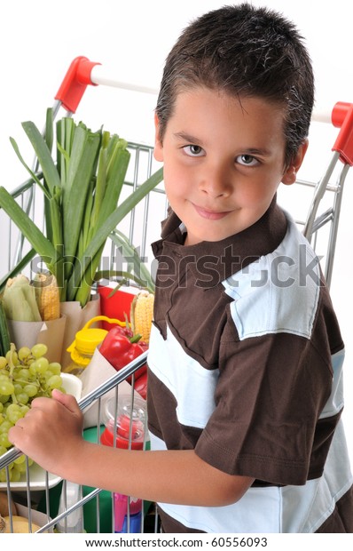 Cute boy with shopping trolley isolated\
on white - a series of SHOPPING TROLLEY\
images.