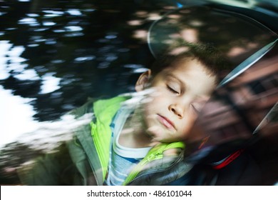 Cute Boy Sleeping In The Car Seat 