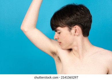 Cute Boy Smelling Underarm. Bad Odor And Body Hair Growing On Puberty