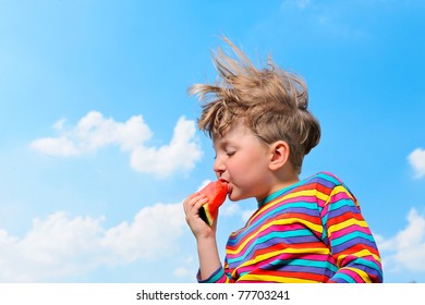 Cute boy with watermelon a blue sky
