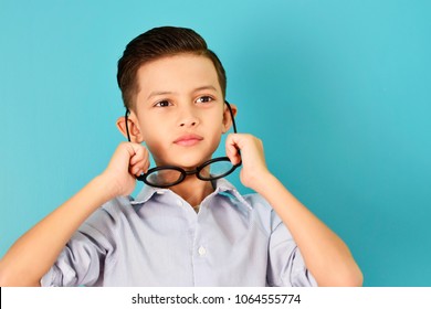 Cute Boy Wearing Big Glasses On Blue Background